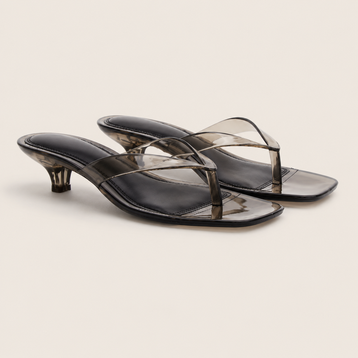 Sandales transparentes à talon kitten vues de dos, finition élégante et moderne.