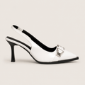Talons femme habillés en gros plan, design raffiné pour occasion chic.